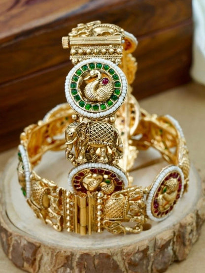 Ishhaara Antique Gold Peacock Bangle - a beautifully crafted gold bangle with peacock motifs and colorful stones
