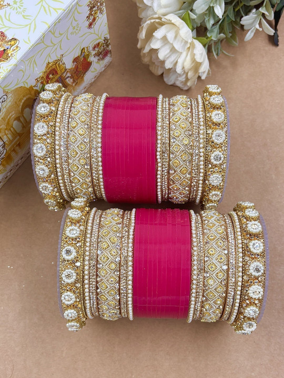 Ishhaara Embellished Pink Kundan Bangles Set - a stack of pink and gold bangles with rhinestone embellishments - view 2