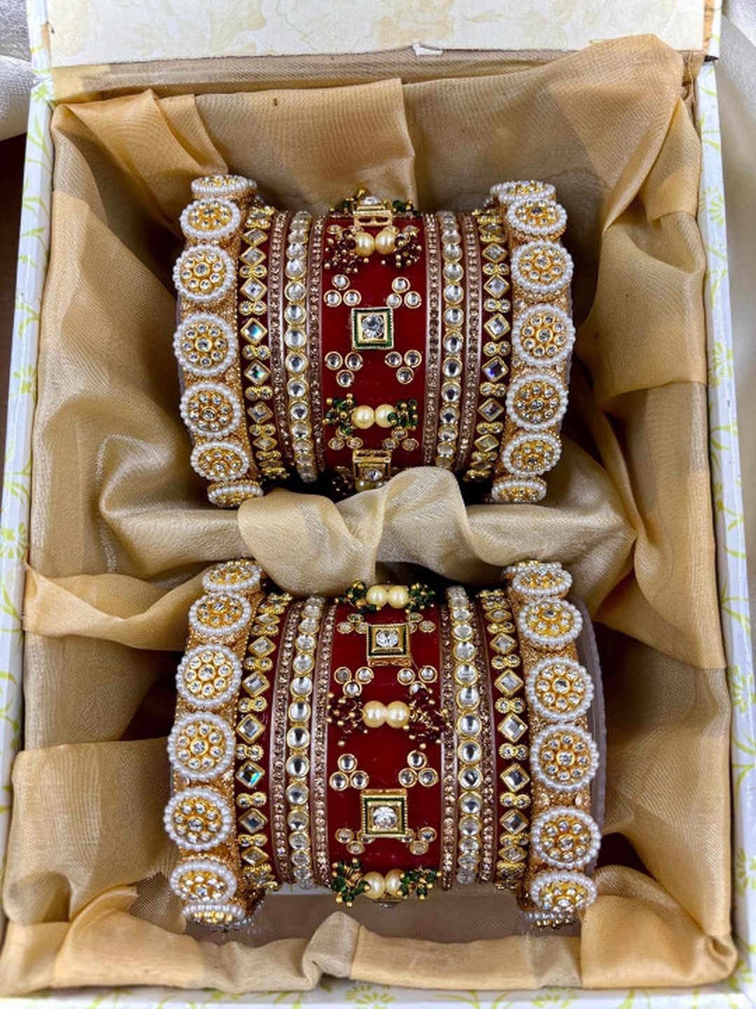 Ishhaara Embellished Red Bangle Set - a pair of intricately designed red and gold bangles with Kundan stones and pearls