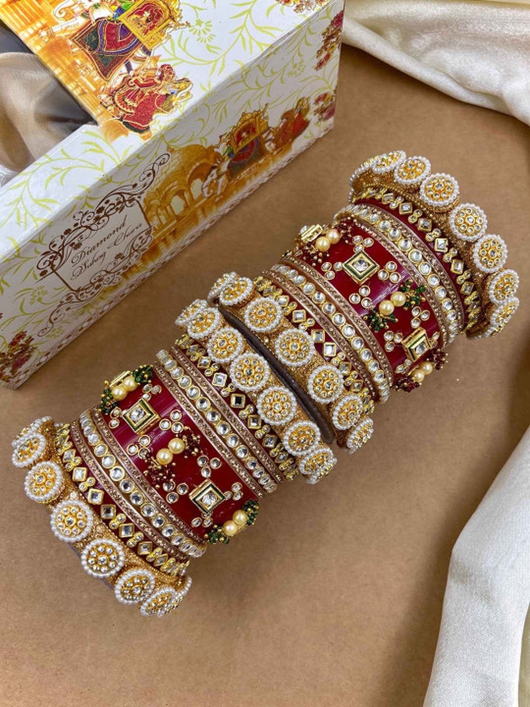 Ishhaara Embellished Red Bangle Set - a pair of intricately designed red and gold bangles with Kundan stones and pearls - view 2