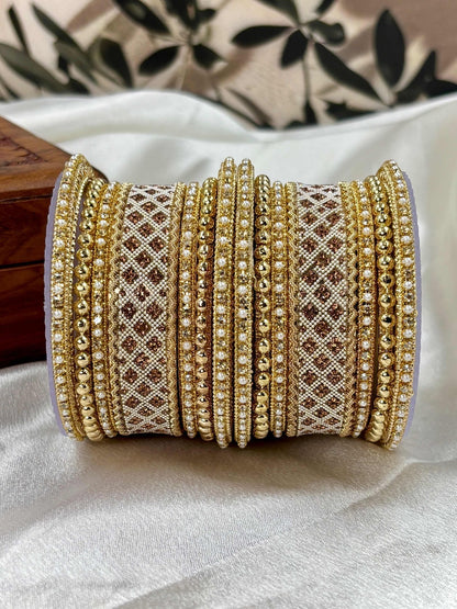 Ishhaara Gold Plated Kundan Bangle Set - a stack of intricately designed gold bangles with stone embellishments