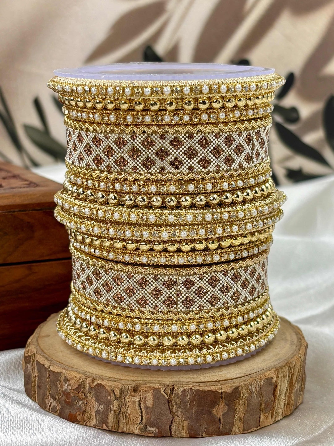 Ishhaara Gold Plated Kundan Bangle Set - a stack of intricately designed gold bangles with stone embellishments - view 2