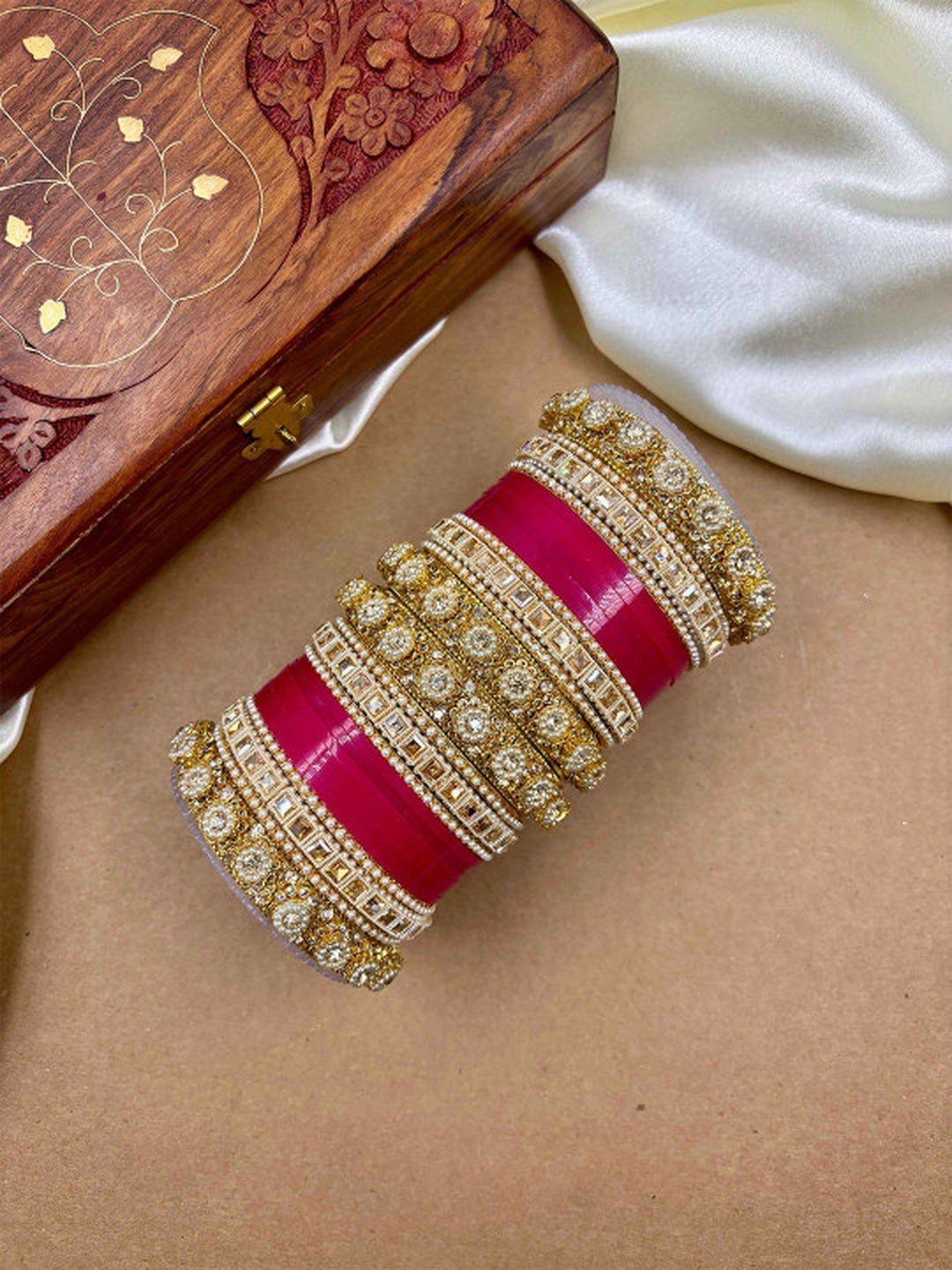 Ishhaara Handcrafted Kundan Bangles Set - a stack of intricately designed bangles with red glass center - view 2