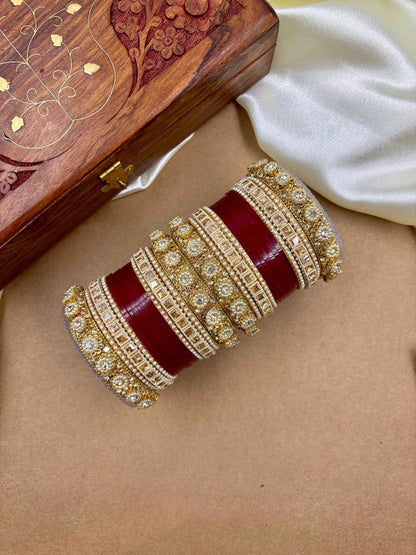Ishhaara Handcrafted Kundan Bangles Set - a stack of intricately designed bangles with red glass center - view 7