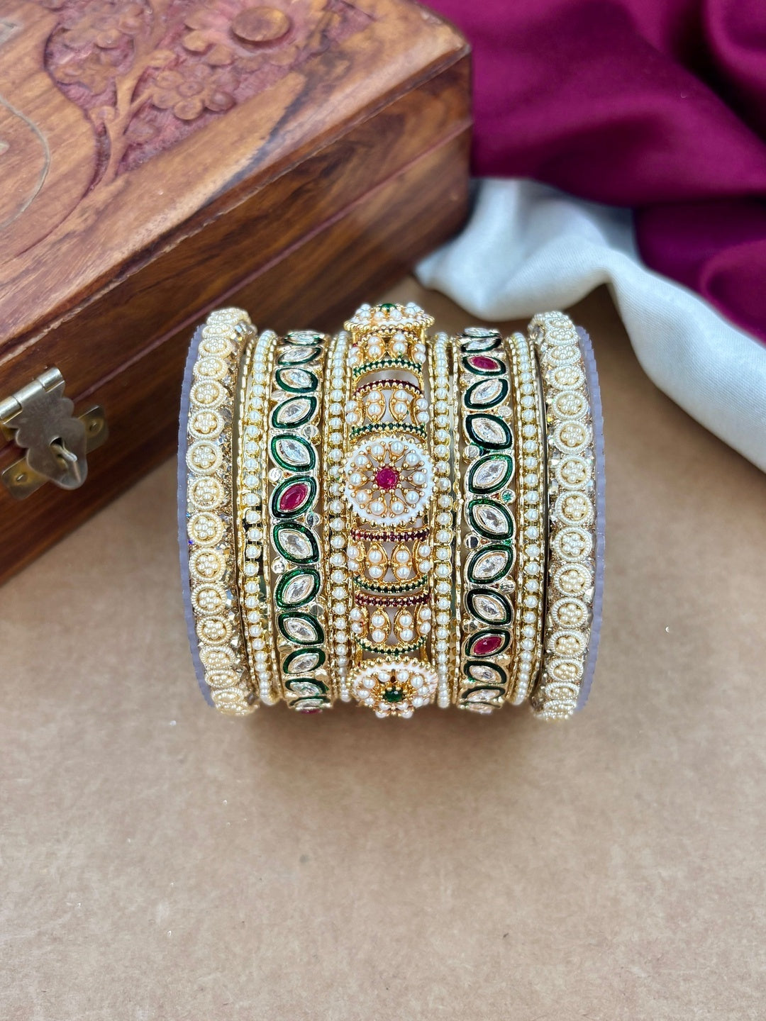 Ishhaara Handcrafted Kundan Bangles Set for Women - a woman wearing green saree with kundan bangles - view 2