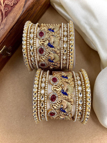 Ishhaara Intricate Gold Peacock Bangle - a gold bangle with peacock design and Kundan Polki stones on a person's wrist - view 2