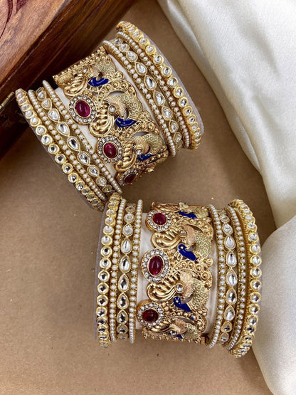 Ishhaara Intricate Gold Peacock Bangle - a gold bangle with peacock design and Kundan Polki stones on a person's wrist - view 3