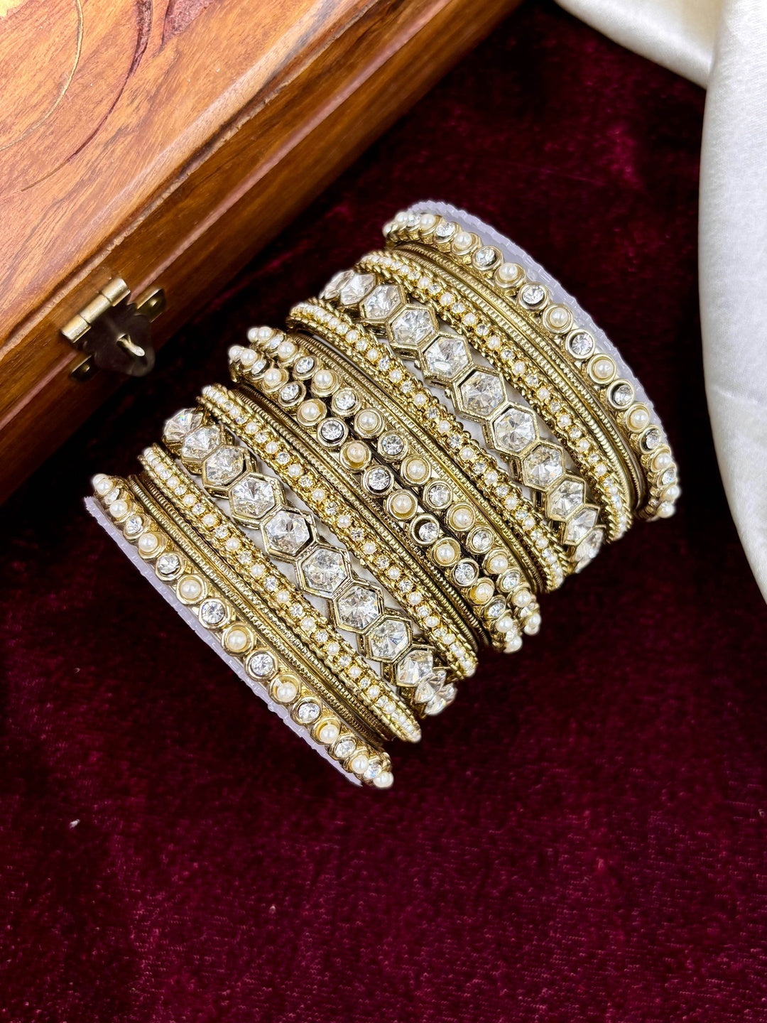 Ishhaara Kundan Bangle Set - a stack of intricately designed gold bangles with precious stones and pearls - view 3
