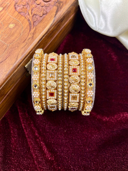 Ishhaara Kundan Bangle Set for Women - a beautiful model wearing gold-plated bangles with intricate designs - view 4