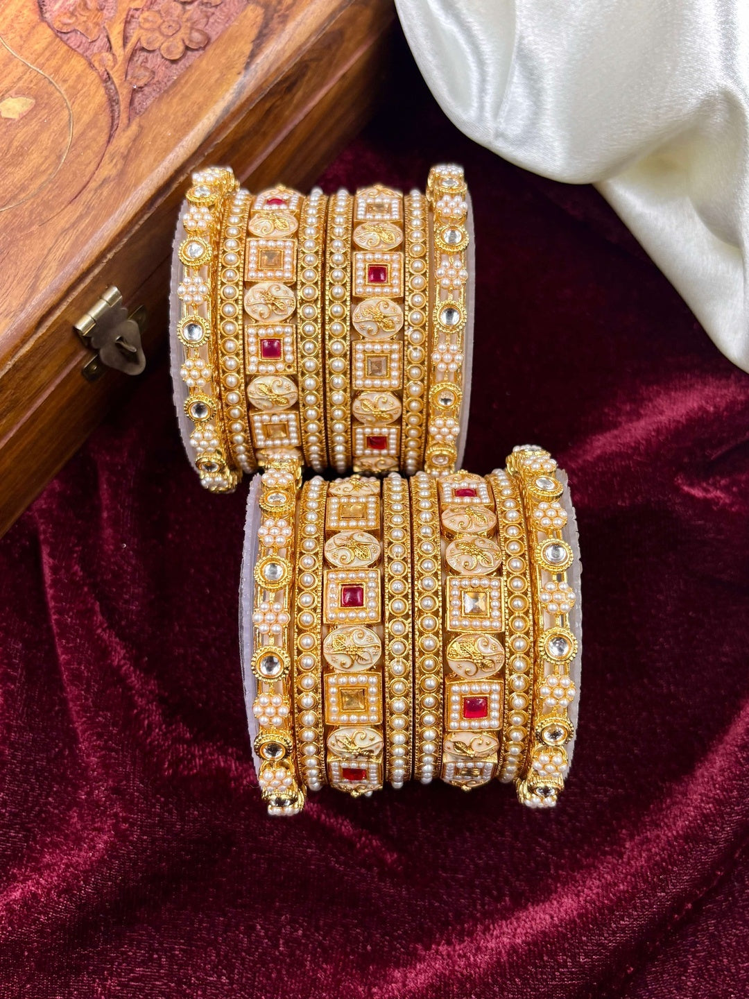 Ishhaara Kundan Bangle Set for Women - a beautiful model wearing gold-plated bangles with intricate designs - view 5