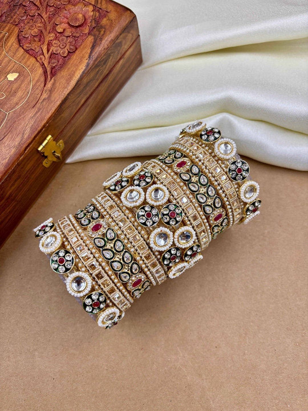 Ishhaara Kundan Bangles Set - a set of intricately designed gold bangles adorned with stones - view 3