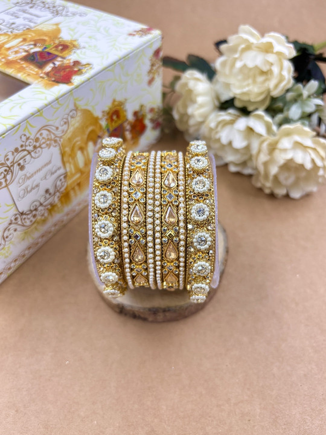 Ishhaara Kundan Bangles Set - a beautifully crafted set of gold-plated bangles adorned with intricate Kundan work and sparkling stones