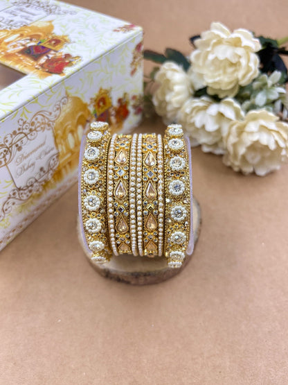Ishhaara Kundan Bangles Set - a beautifully crafted set of gold-plated bangles adorned with intricate Kundan work and sparkling stones