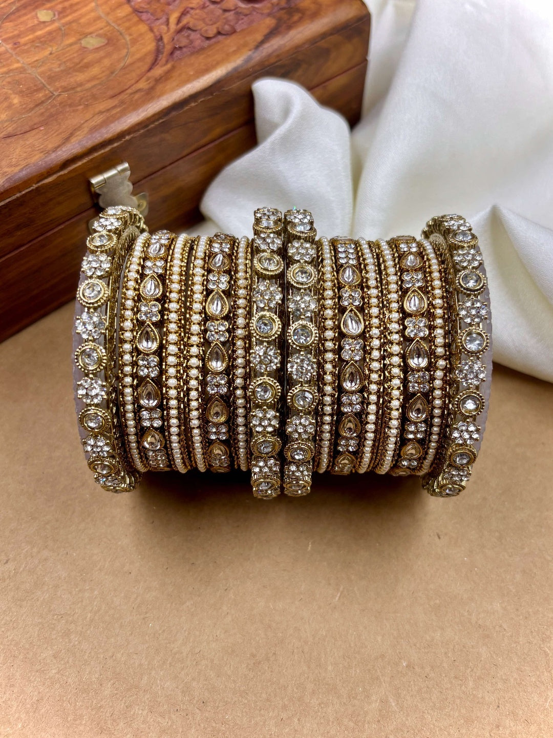 Ishhaara Kundan Bangles Set - A beautiful set of gold bangles adorned with stones and pearls - view 5