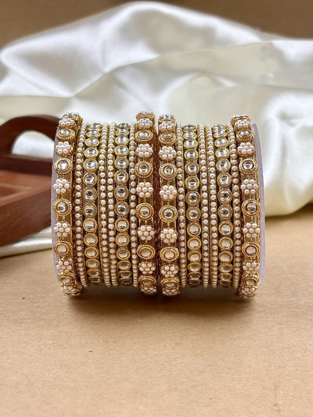 Ishhaara Kundan Bangles Set - a stack of gold bangles with kundan and pearl embellishments - view 2