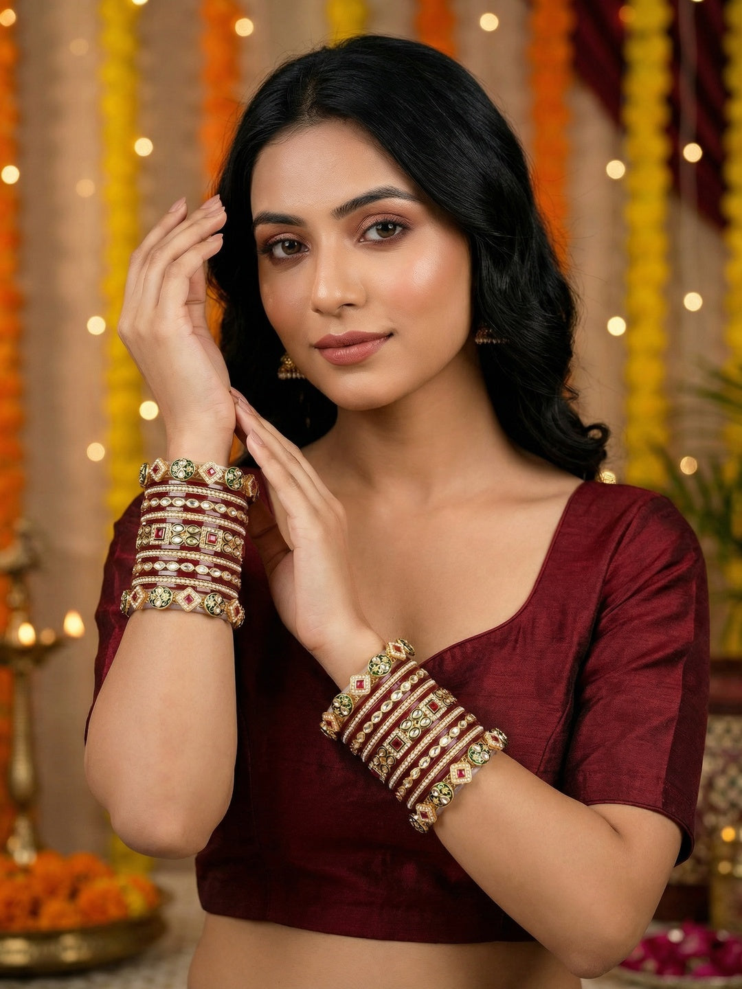 Ishhaara Maroon Kundan Bangle Set - a woman wearing a maroon top and gold kundan bangles