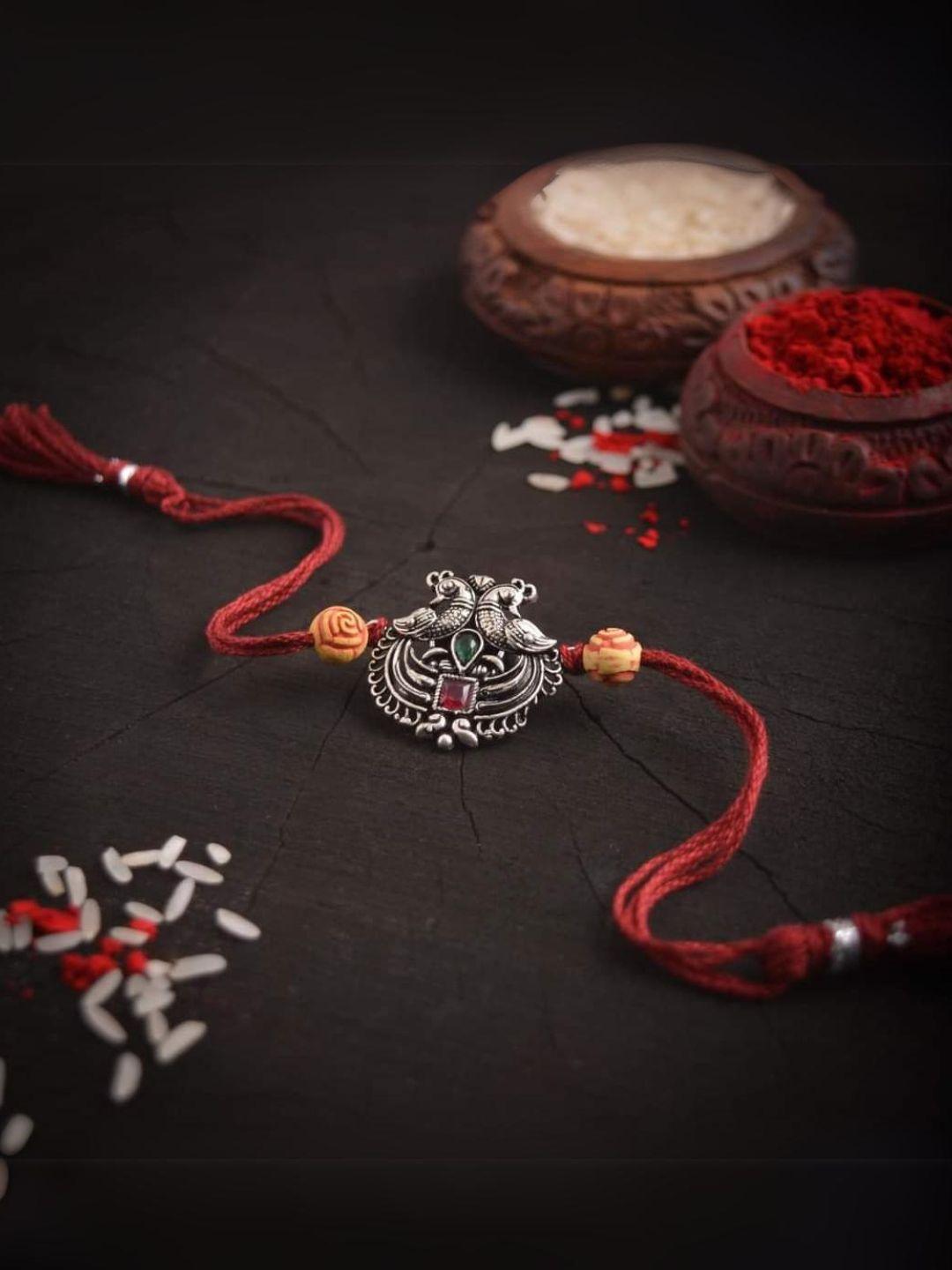 Ishhaara Peacock Shaped German Silver Rakhi