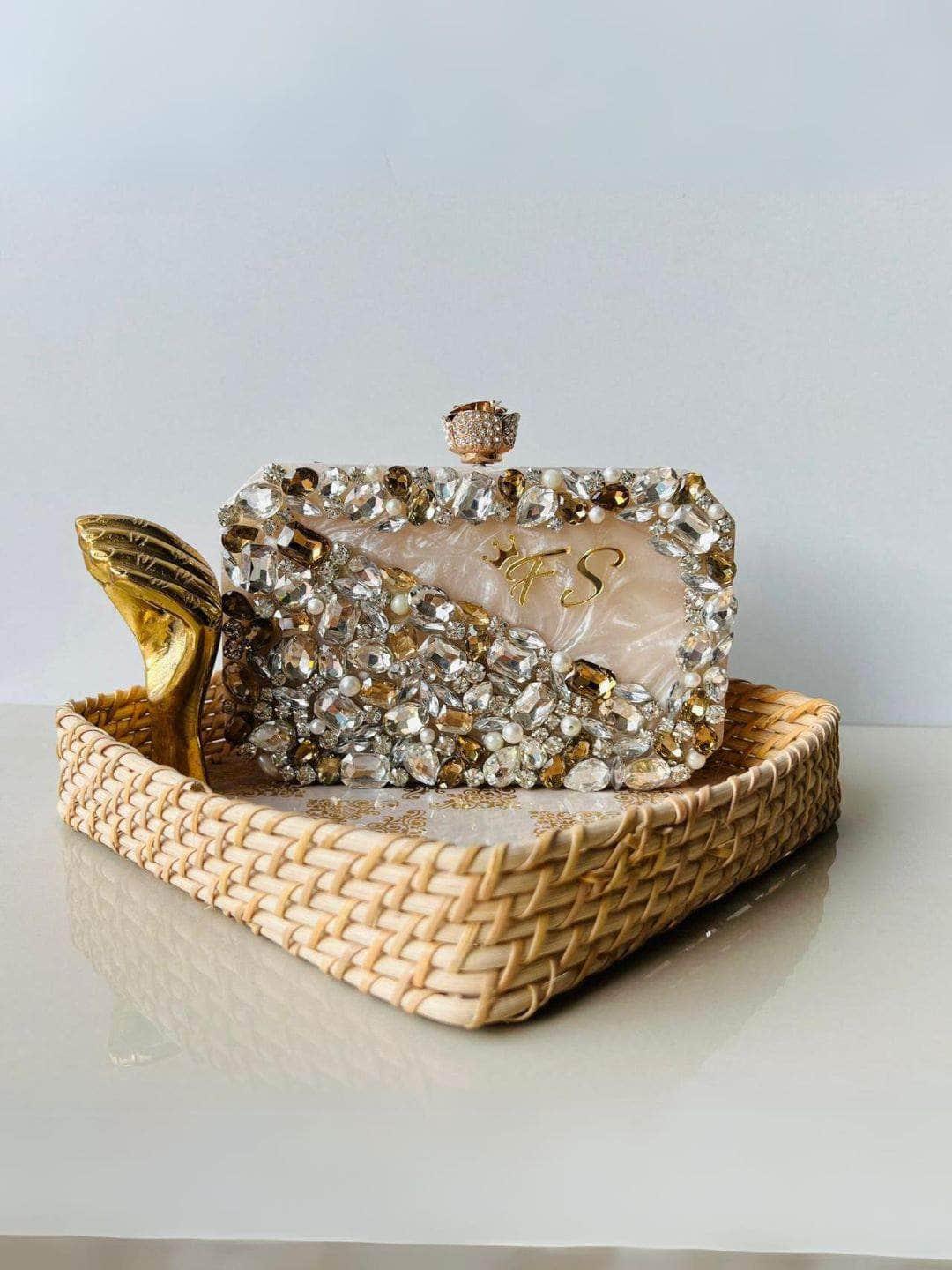 Ishhaara Pearl And Stone Embellished Resin Clutch