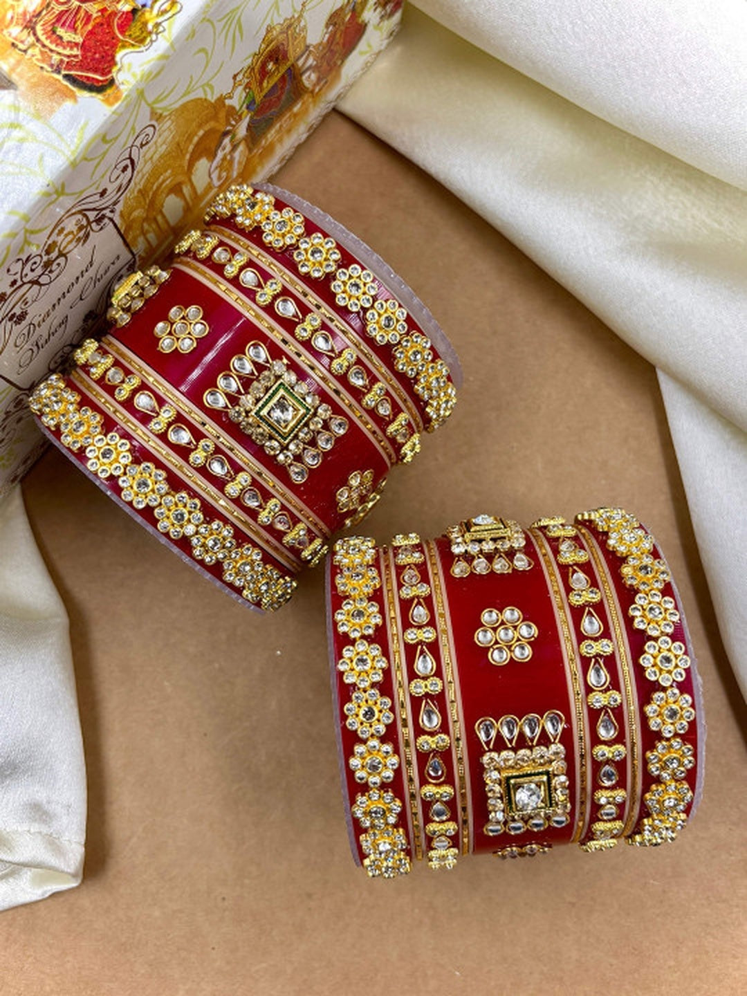 Ishhaara Red Kundan Bangles - A pair of intricately designed red kundan bangles with gold and stone embellishments - view 3