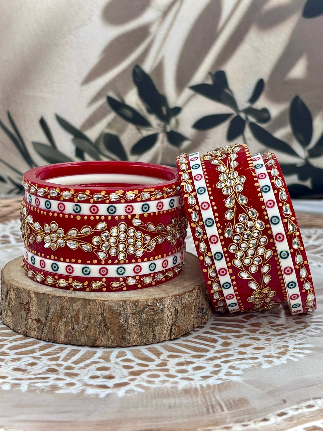 Ishhaara Red Kundan Bangles Set - A stack of intricately designed red bangles with clear stones - view 2
