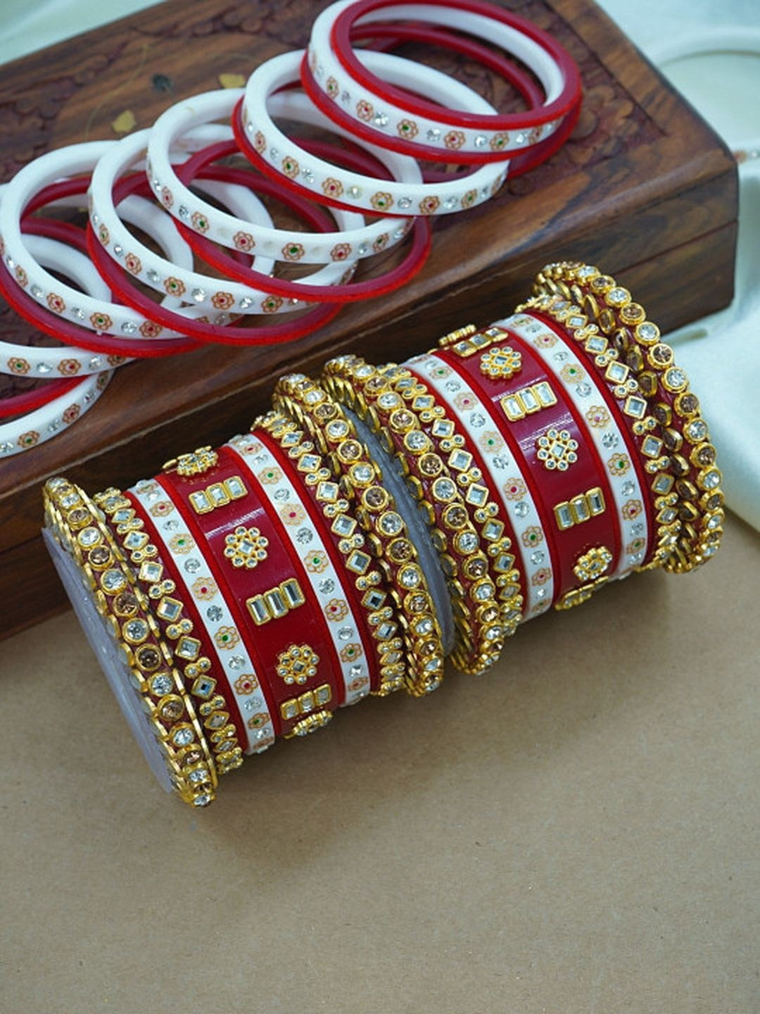 Ishhaara Traditional Red Kundan Bangle Set - a close-up view of intricately designed red and white bangles with gold and stone embellishments - view 2