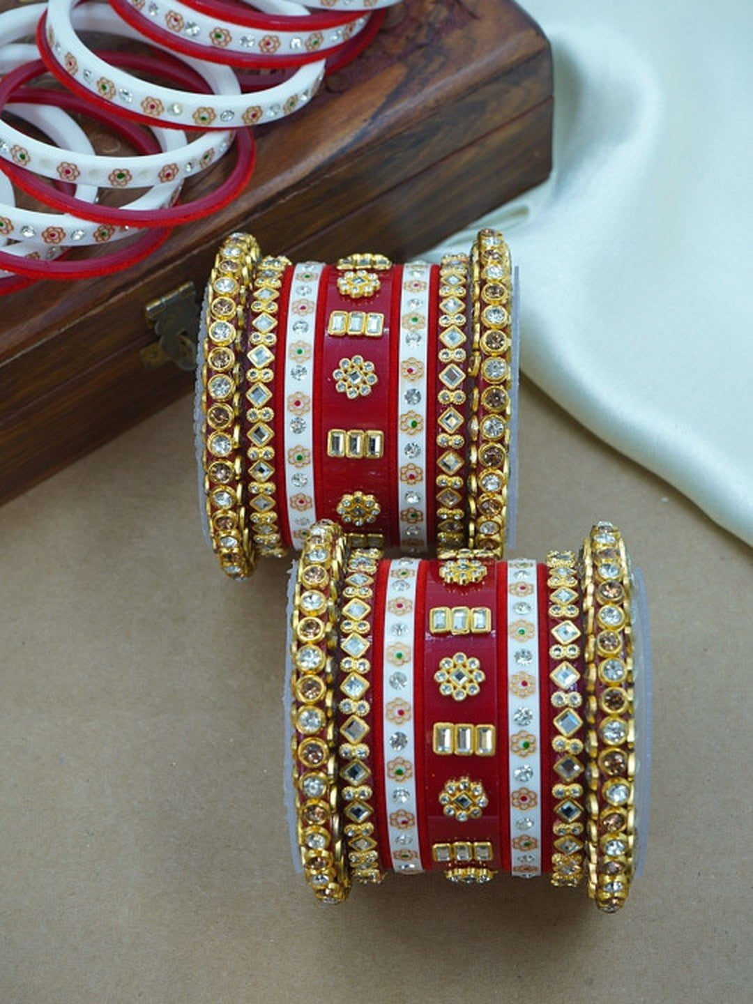 Ishhaara Traditional Red Kundan Bangle Set - a close-up view of intricately designed red and white bangles with gold and stone embellishments - view 3
